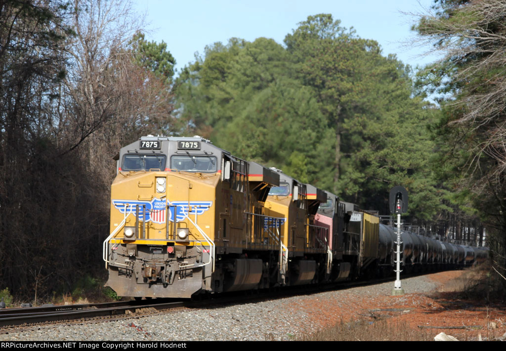 UP 7875 leads two other UP units eastbound on NS train 64D